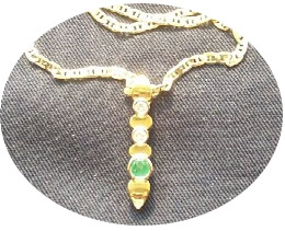 Gold necklace with diamonds and emeralds